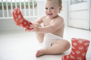 baby-girl-putting-on-galoshes-1